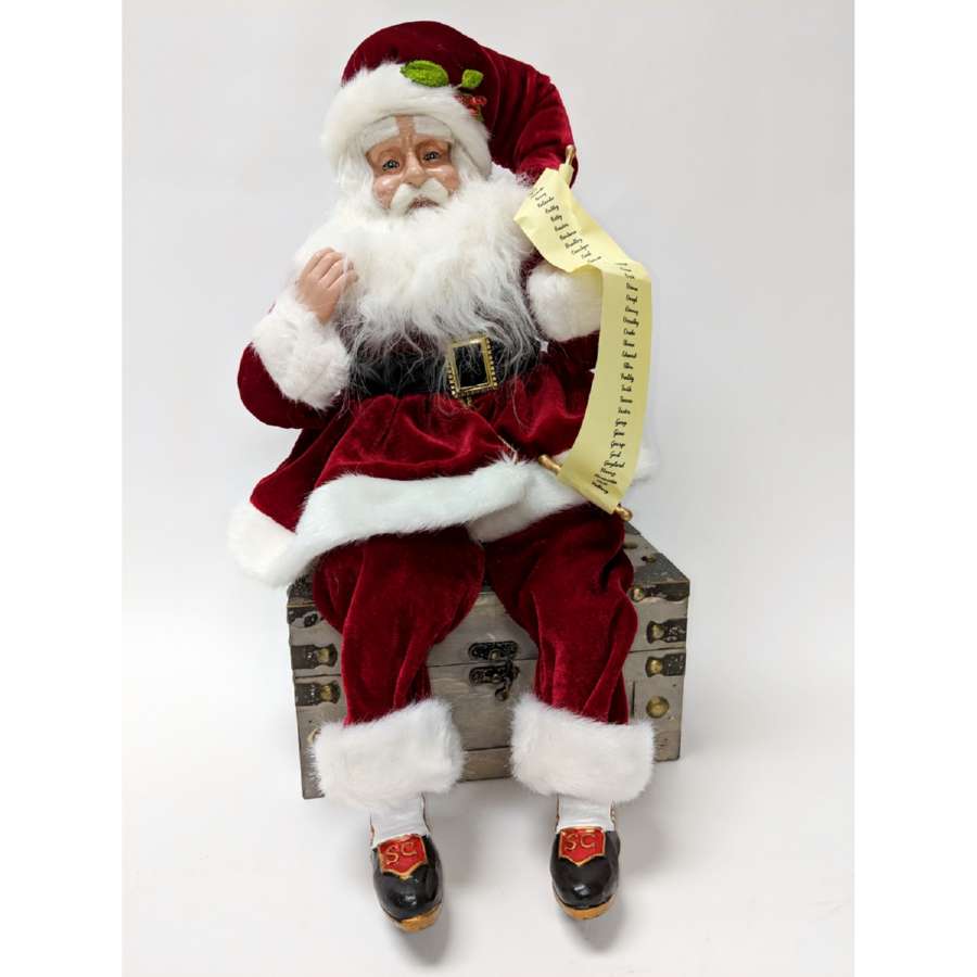 Shop now in UK K&K Interiors 51411A - Sitting Red Velvet Santa with List